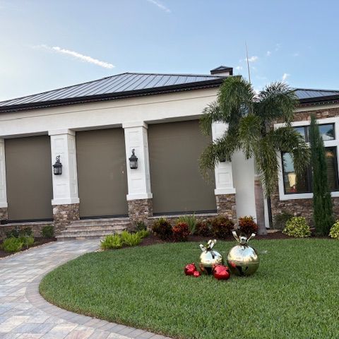 A Central Florida estate home with three motorized screens lowered